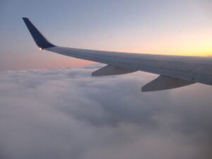 Airplane wing in clouds
